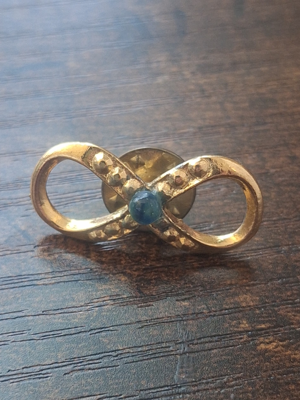 Vintage Gold Infinity Brooch with Blue Cabochon
